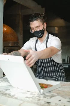 experienced pizza chef working wood fired oven