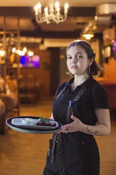 friendly server helping restaurant customers