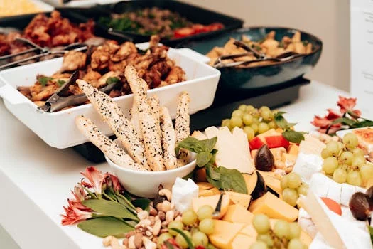 small catering spread with assorted pizzas